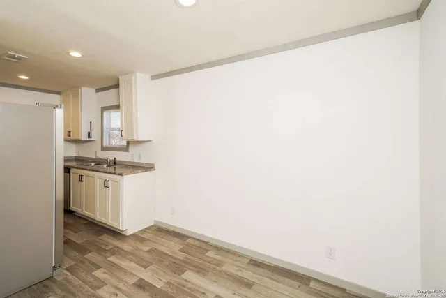 a kitchen with a stove and a microwave