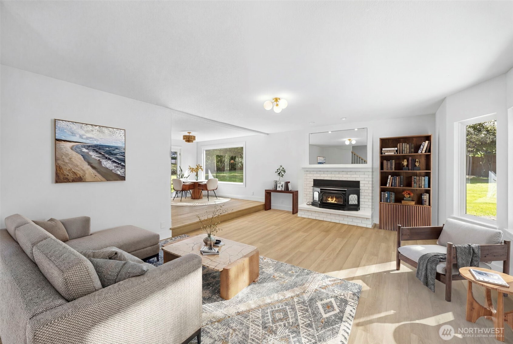 121 West Winesap Road Bothell, WA 98012 - Photo 6 of 29 a living room with furniture large window and a fireplace
