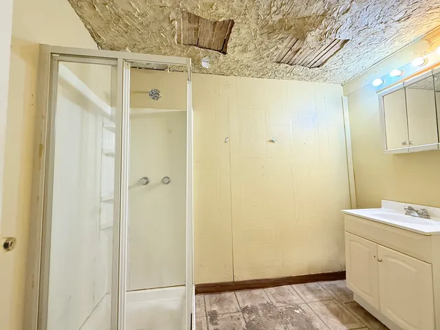 a kitchen with a sink and a refrigerator