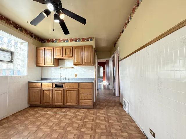 a kitchen with stainless steel appliances granite countertop a sink and cabinets