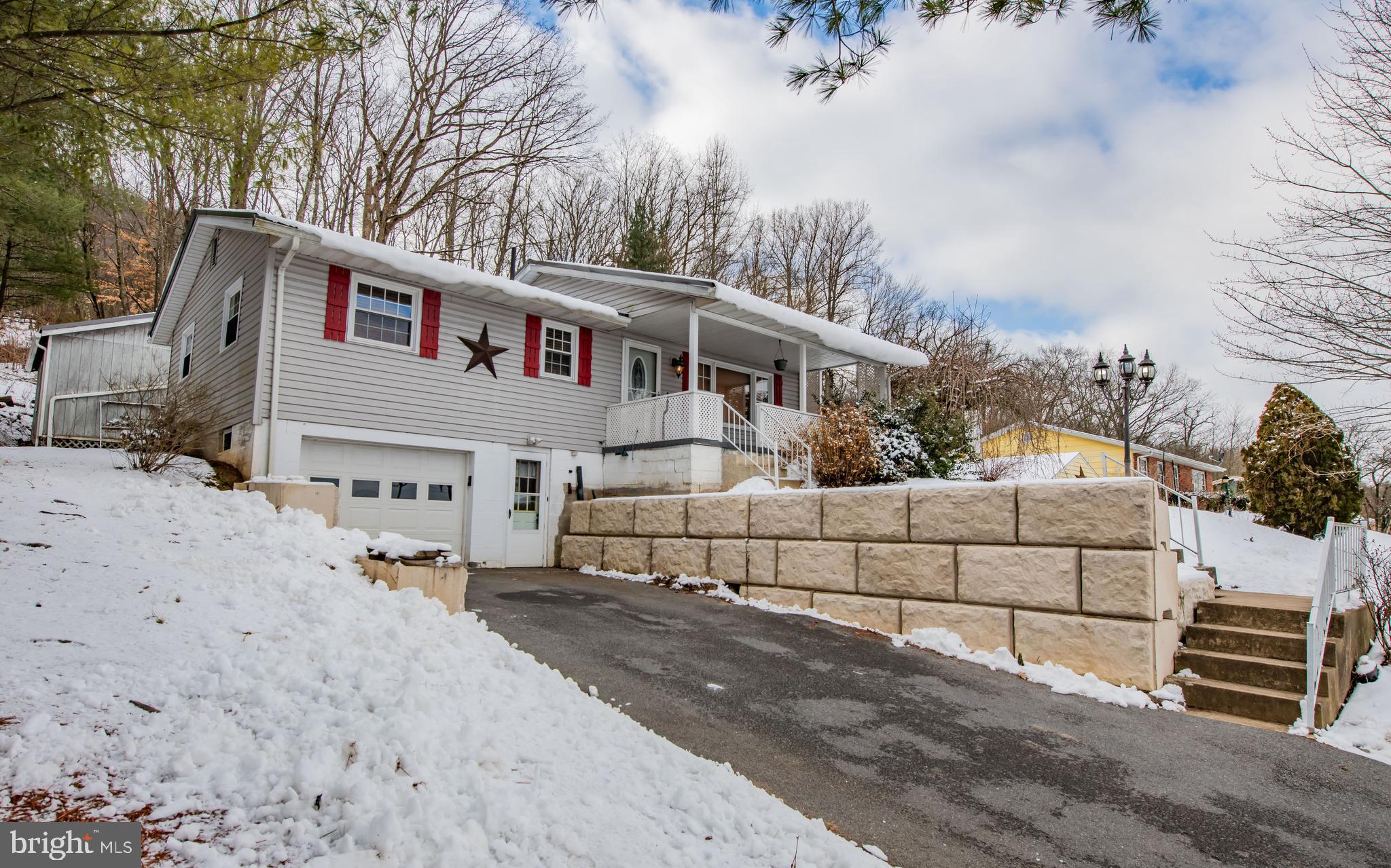 507 Grape Street Lock Haven, PA 17745 - Photo 24 of 26 a front view of a house with a yard and garage
