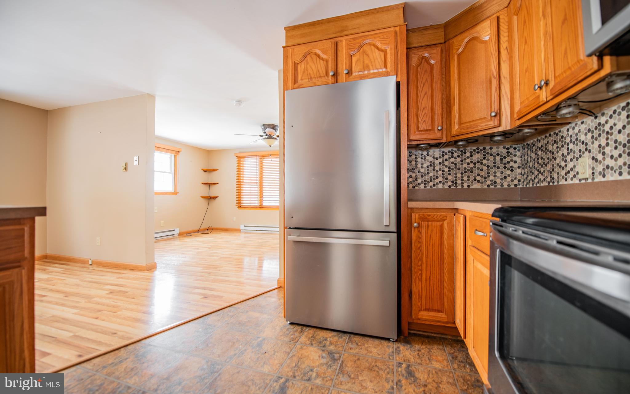 507 Grape Street Lock Haven, PA 17745 - Photo 6 of 26 a white refrigerator freezer and a stove sitting inside of a kitchen