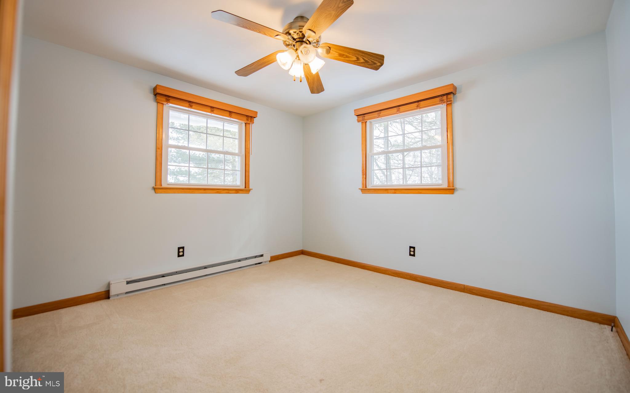 507 Grape Street Lock Haven, PA 17745 - Photo 10 of 26 an empty room with windows and fan