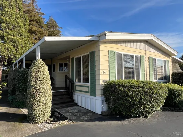 a view of a house with a garden