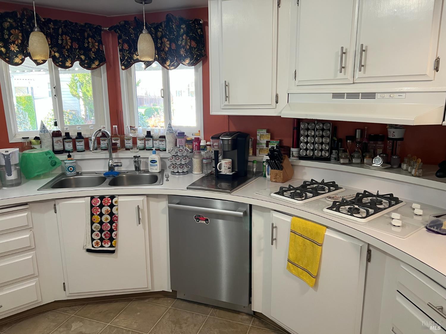161 Bear Flag Road Sonoma, CA 95476 - Photo 13 of 57 a kitchen with a stove a refrigerator and cabinets