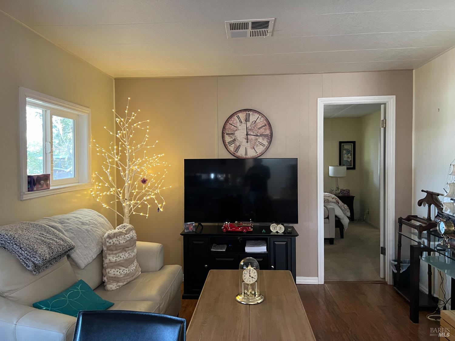 161 Bear Flag Road Sonoma, CA 95476 - Photo 14 of 57 a living room with furniture and a flat screen tv