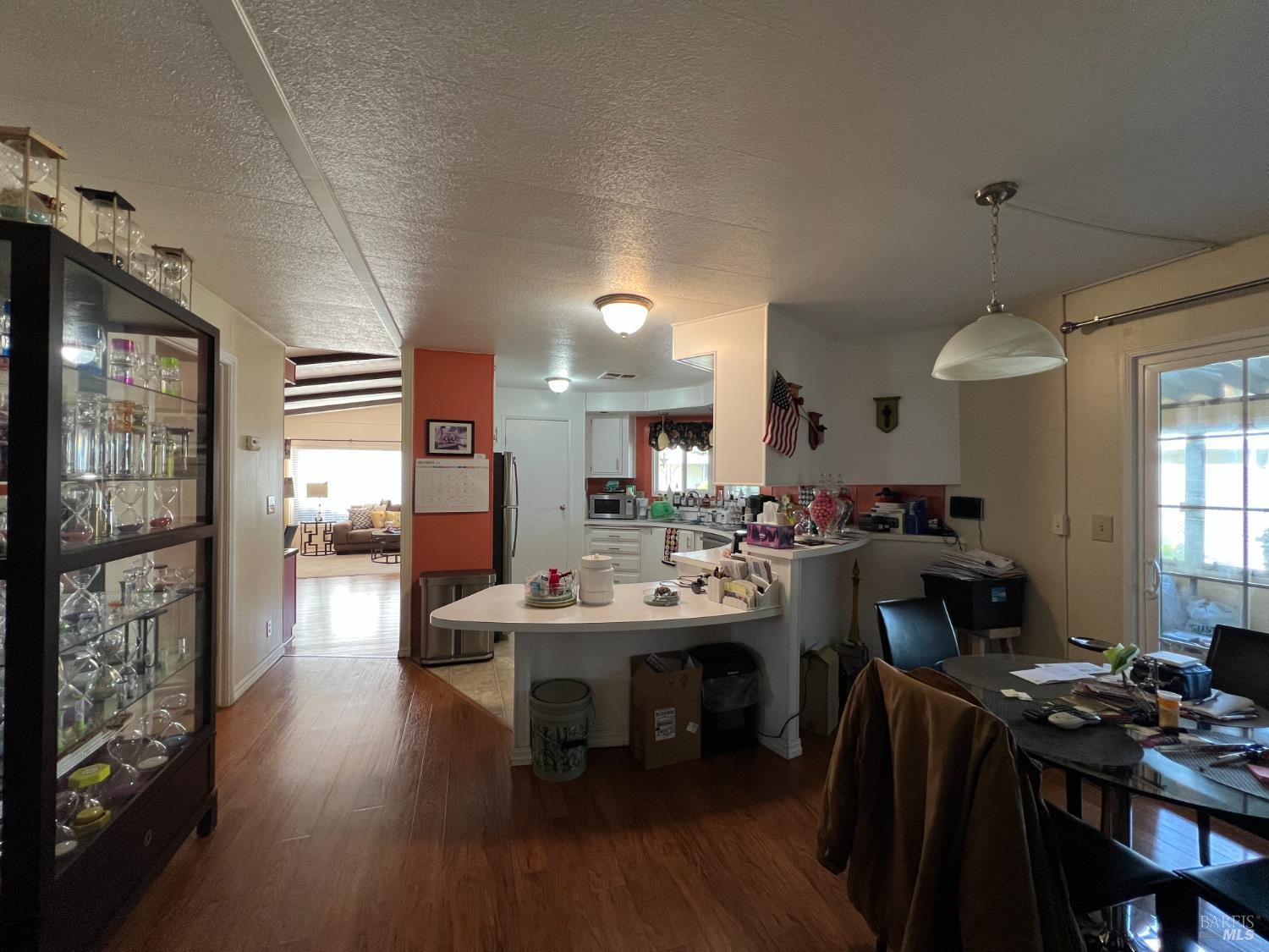 161 Bear Flag Road Sonoma, CA 95476 - Photo 16 of 57 a view of a dining room with furniture and wooden floor