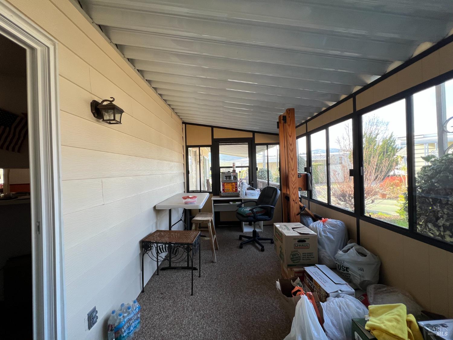 161 Bear Flag Road Sonoma, CA 95476 - Photo 23 of 57 a living room with furniture and floor to ceiling window