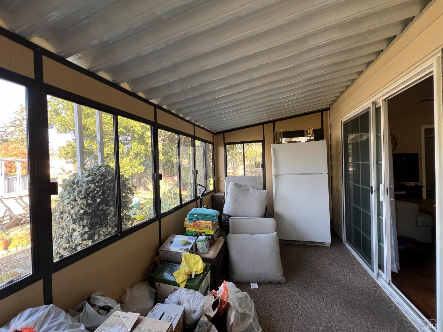 161 Bear Flag Road Sonoma, CA 95476 - Photo 24 of 57 a room with furniture and large windows