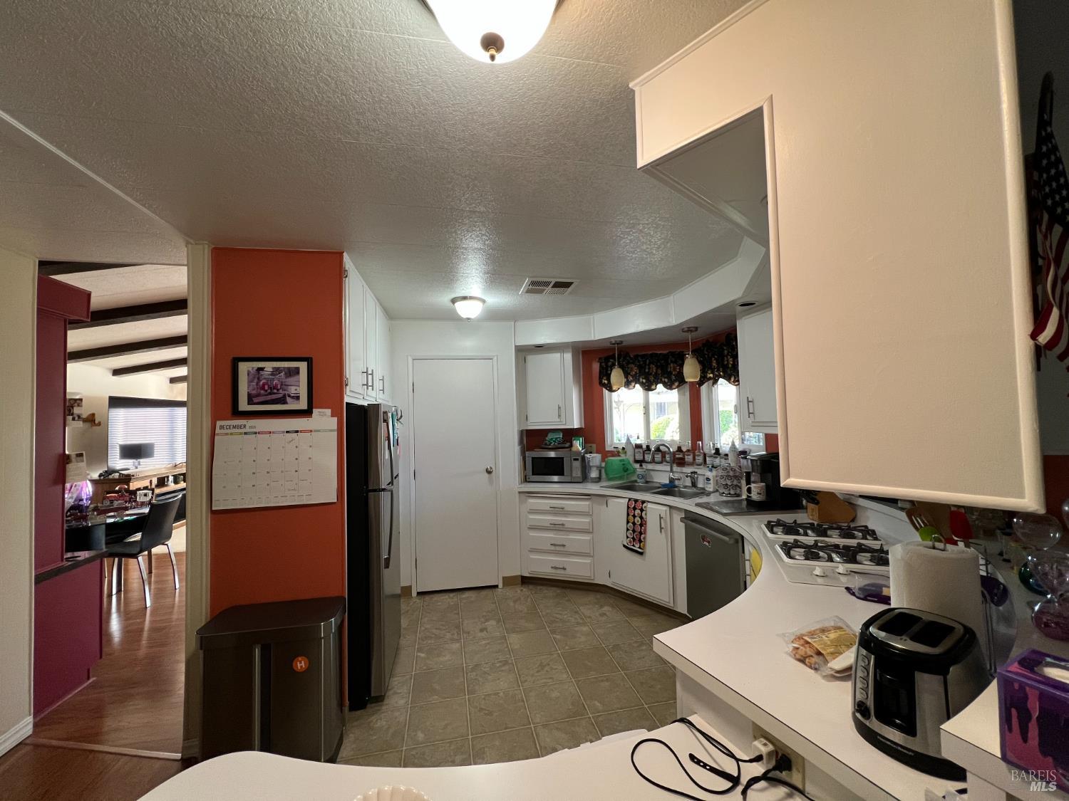 161 Bear Flag Road Sonoma, CA 95476 - Photo 38 of 57 a kitchen with stainless steel appliances a sink stove and refrigerator