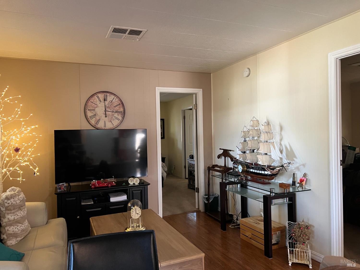 161 Bear Flag Road Sonoma, CA 95476 - Photo 42 of 57 a living room with furniture and a flat screen tv
