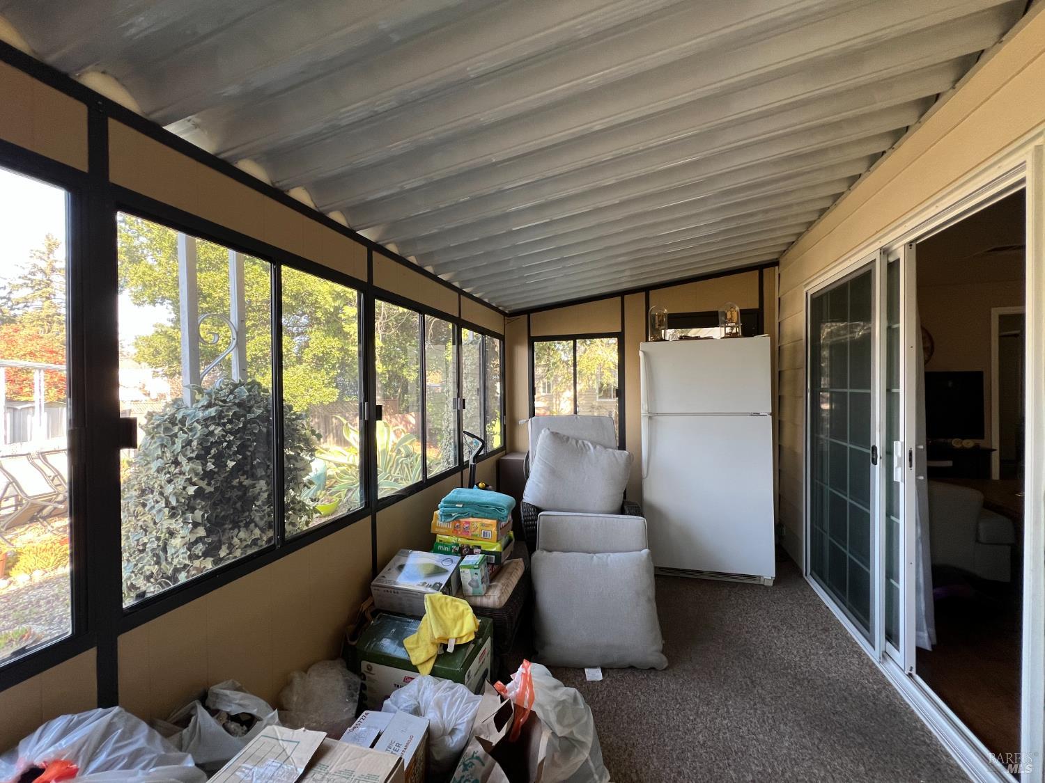 161 Bear Flag Road Sonoma, CA 95476 - Photo 50 of 57 a room with furniture and large windows