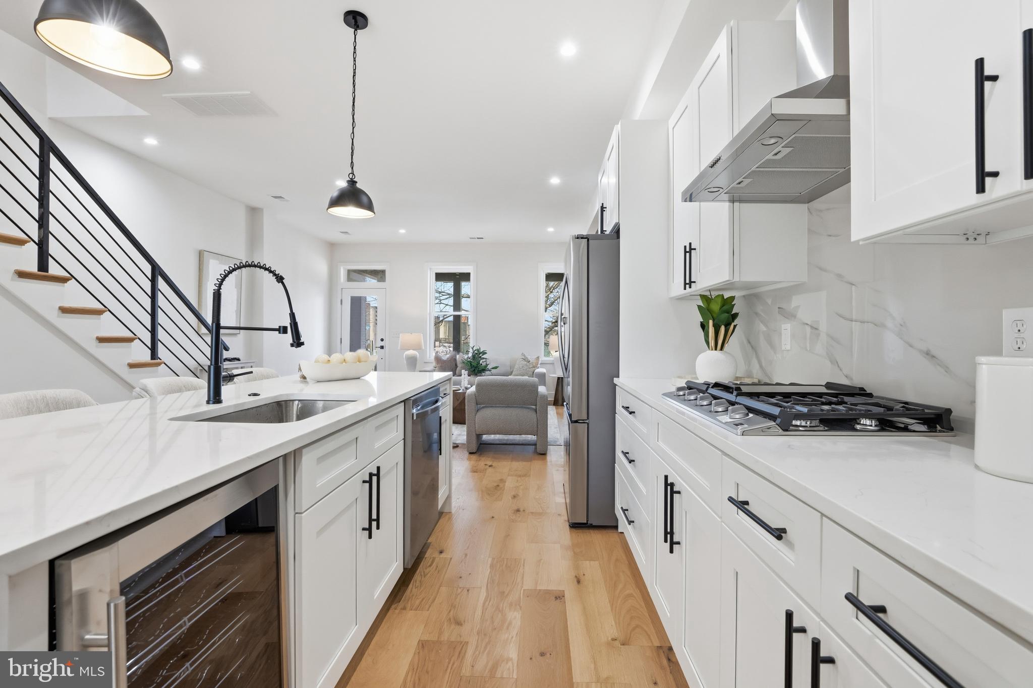 2815 North Capitol Street Northeast Washington, DC 20002 - Photo 16 of 87 a kitchen with stainless steel appliances a sink stove and cabinets