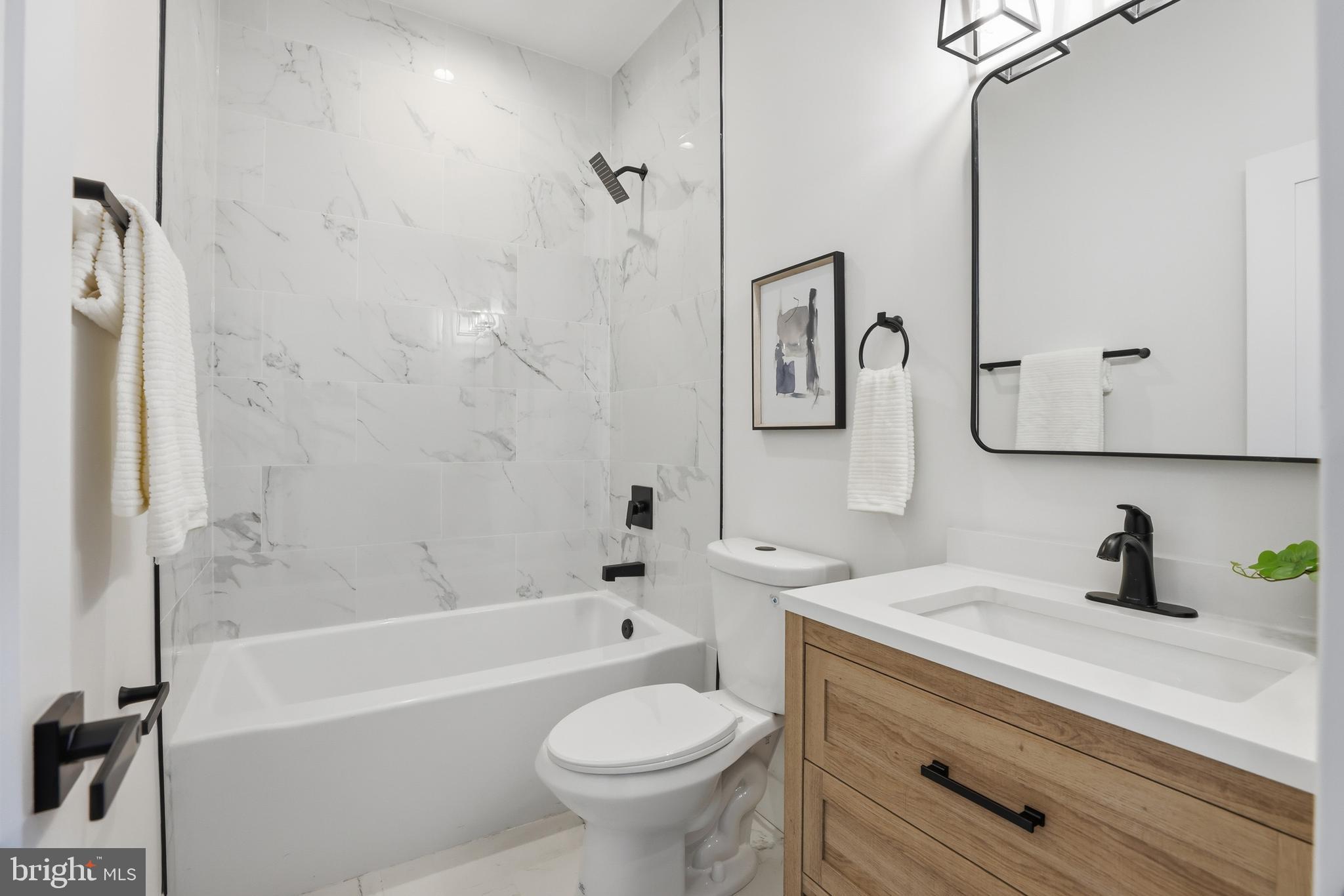 2815 North Capitol Street Northeast Washington, DC 20002 - Photo 24 of 87 a bathroom with a sink a toilet and a bathtub