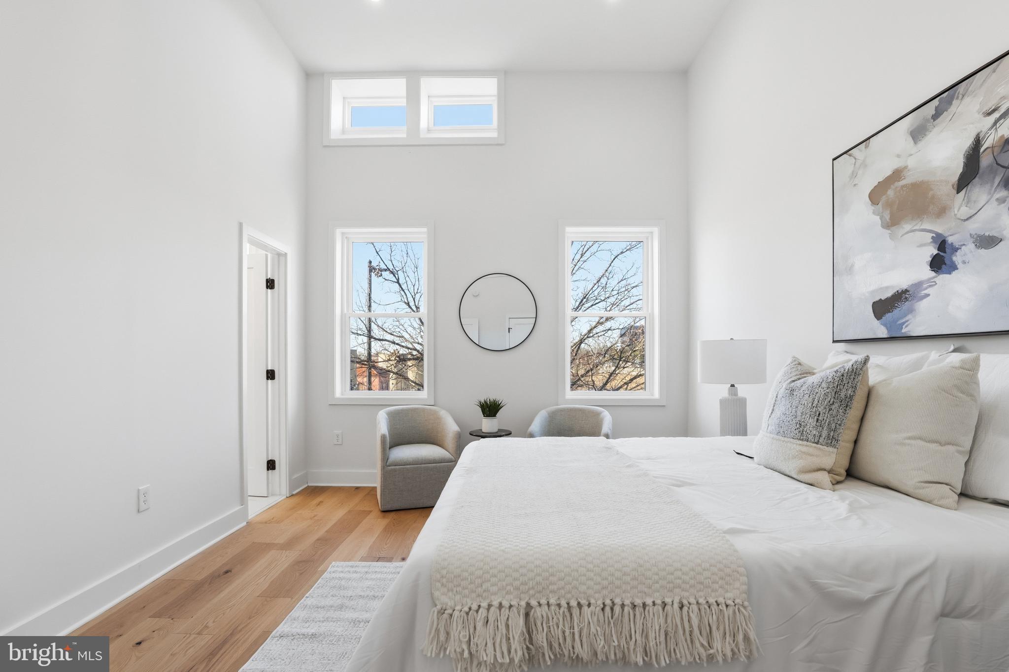 2815 North Capitol Street Northeast Washington, DC 20002 - Photo 31 of 87 a bedroom with a bed and a painting on the wall
