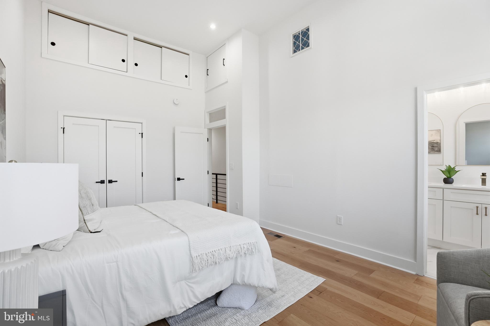 2815 North Capitol Street Northeast Washington, DC 20002 - Photo 33 of 87 a spacious bedroom with a bed and a cabinets