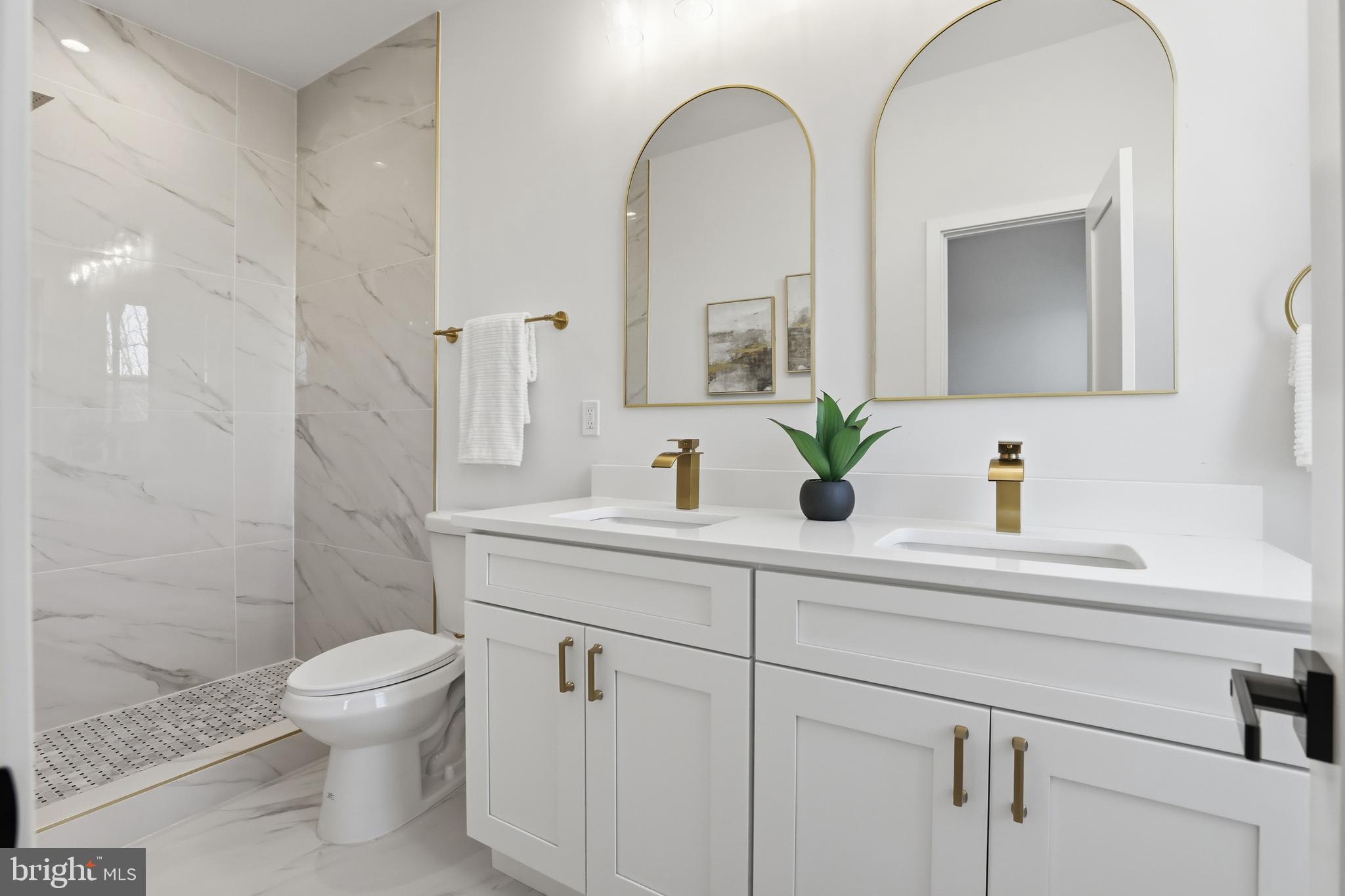 2815 North Capitol Street Northeast Washington, DC 20002 - Photo 36 of 87 a bathroom with a double vanity sink toilet and shower