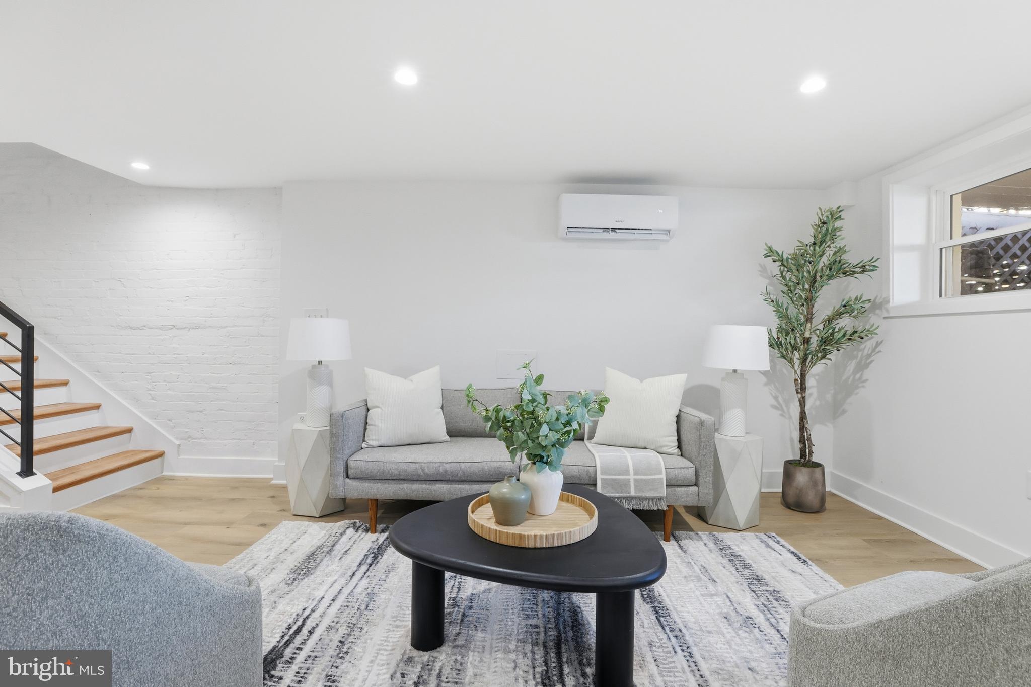 2815 North Capitol Street Northeast Washington, DC 20002 - Photo 43 of 87 a living room with furniture and a potted plant