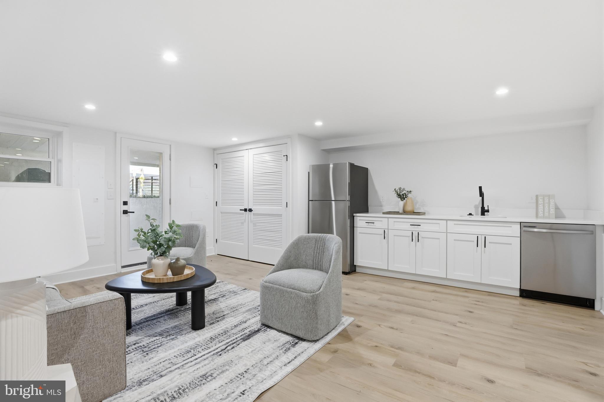 2815 North Capitol Street Northeast Washington, DC 20002 - Photo 44 of 87 a living room with furniture and view of kitchen