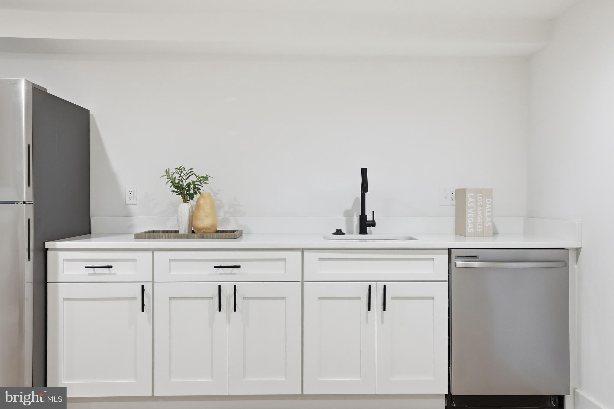 2815 North Capitol Street Northeast Washington, DC 20002 - Photo 45 of 87 a view of cabinets a sink and a stove in a kitchen