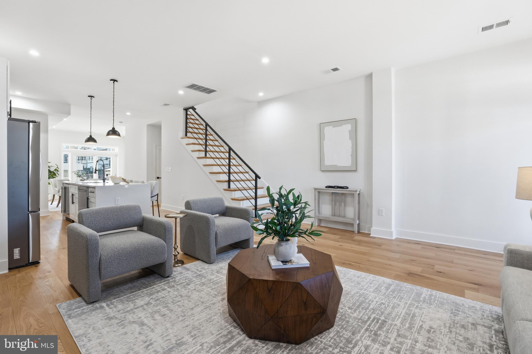 2815 North Capitol Street Northeast Washington, DC 20002 - Photo 9 of 87 a living room with furniture potted plant and a rug