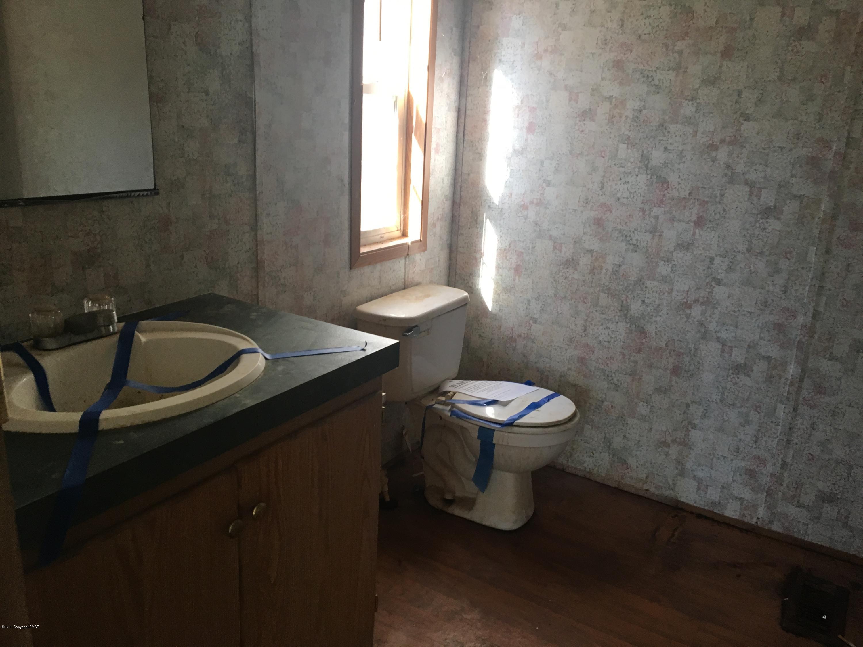 1109 Bayberry Road Effort, PA 18330 - Photo 4 of 8 a bathroom with a sink and a toilet