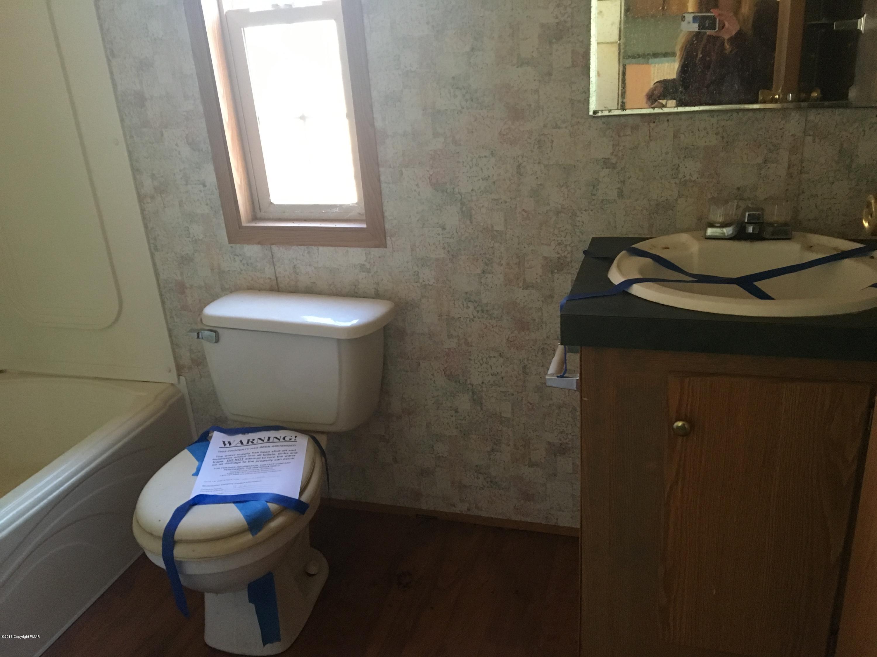 1109 Bayberry Road Effort, PA 18330 - Photo 8 of 8 a bathroom with a toilet and a sink