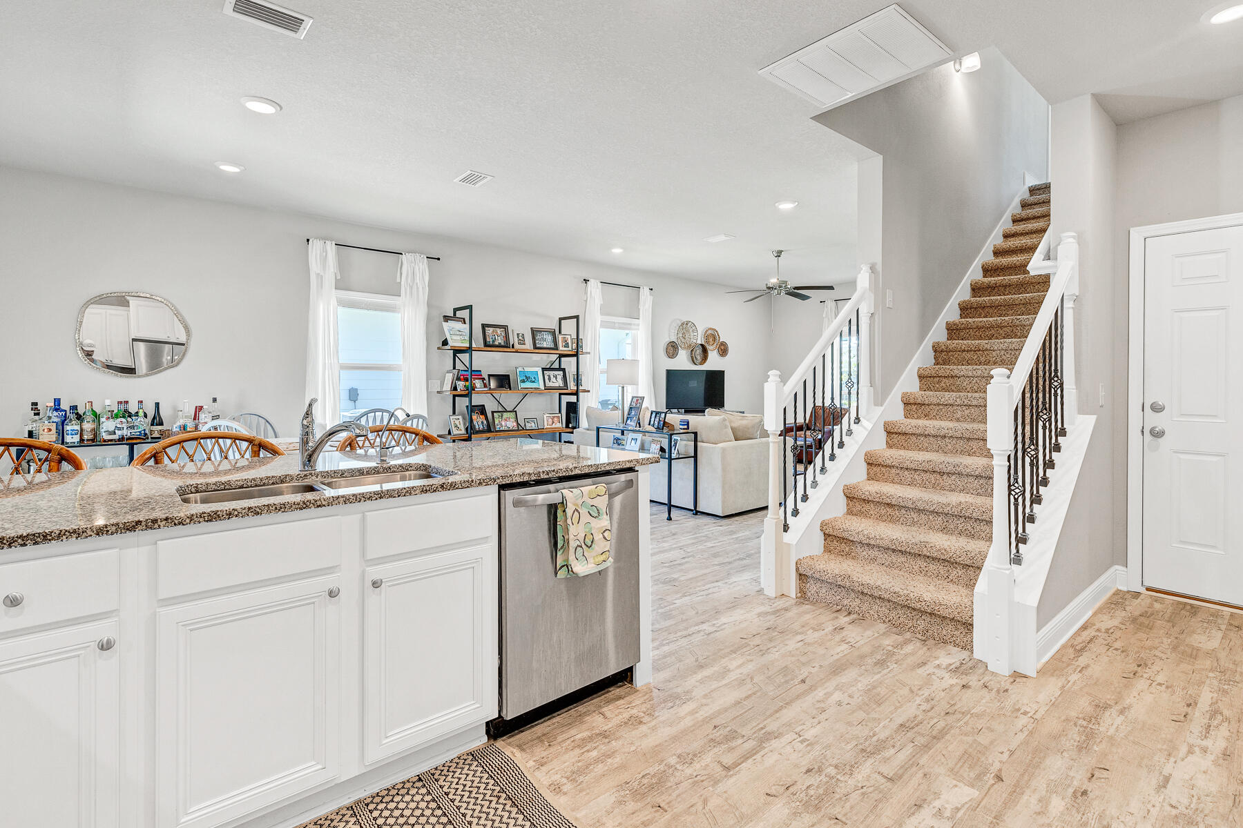 186 Southern Pnes Road Santa Rosa Beach, FL 32459 - Photo 8 of 32 a kitchen with white cabinets and sink