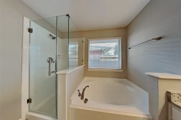 a white bath tub sitting next to a window