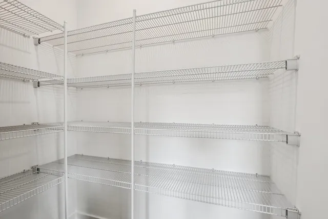 a view of a room with racks on the wall