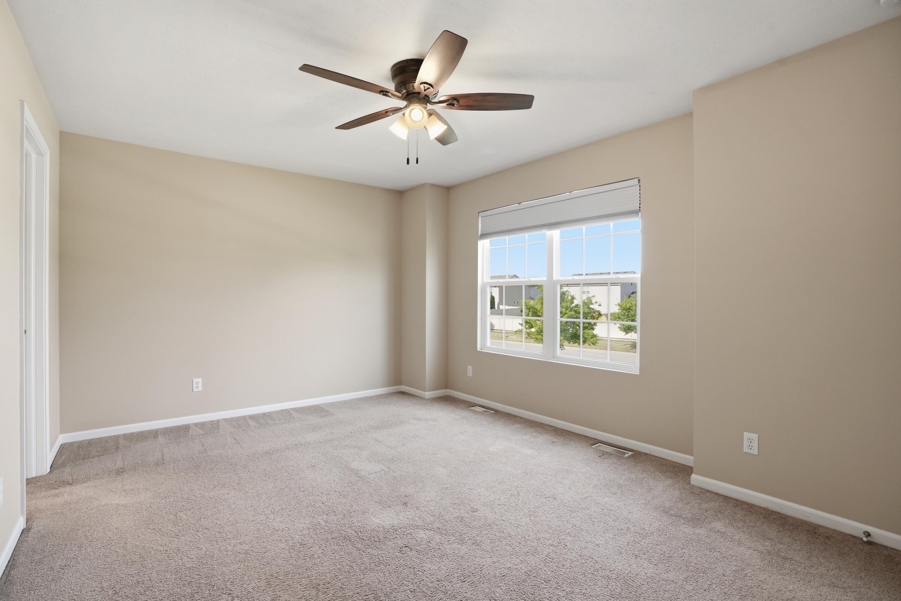 11351 Rhode Island Street Crown Point, IN 46307 - Photo 10 of 18 an empty room with windows and fan