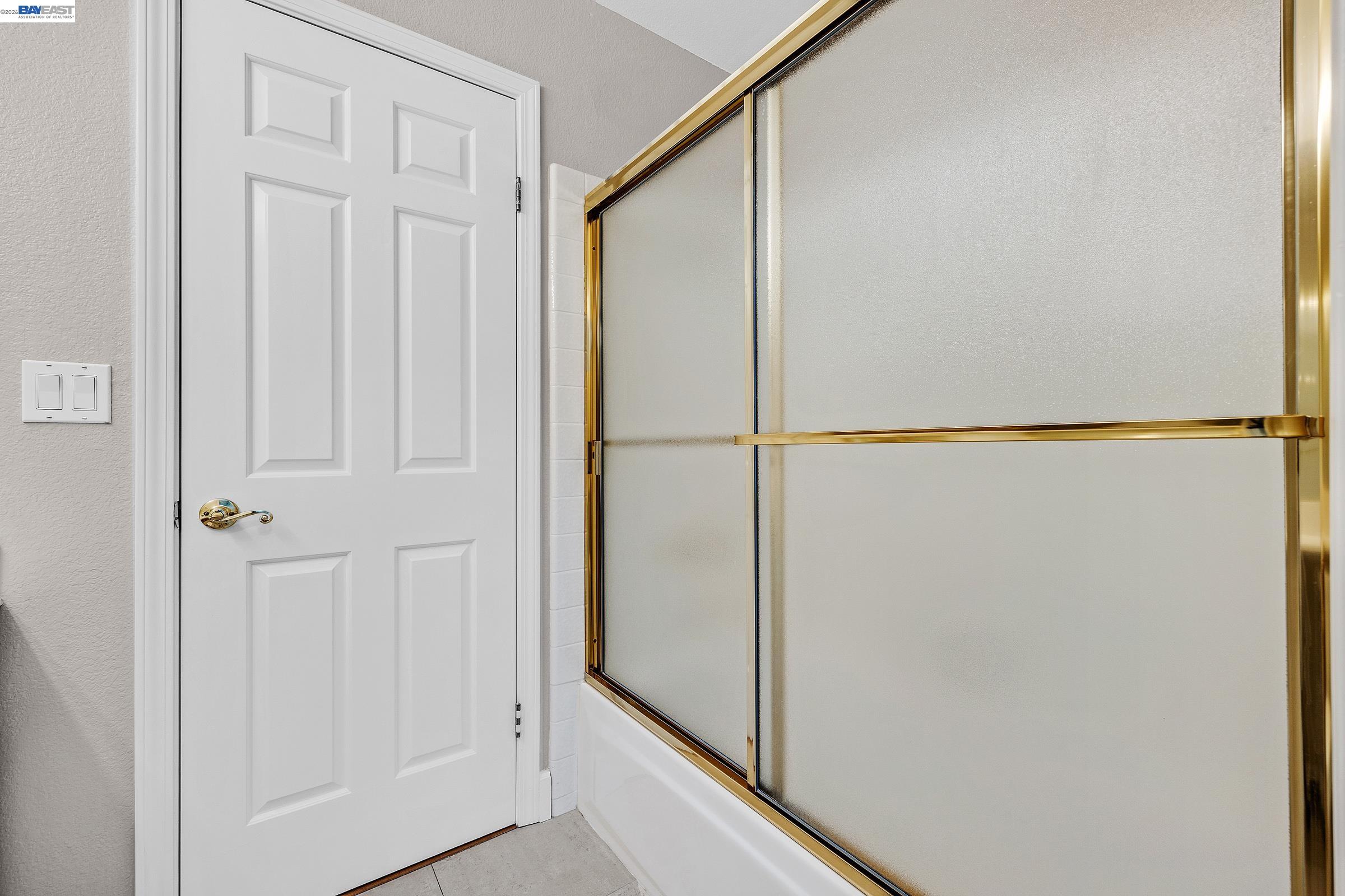 3769 Crow Canyon Road San Ramon, CA 94582 - Photo 42 of 56 a bathroom with a glass shower door