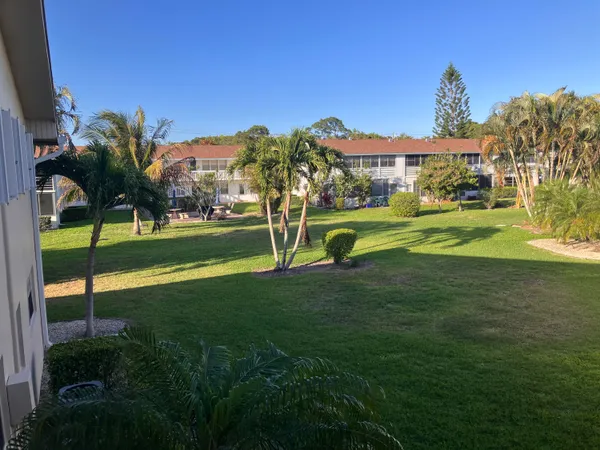 a view of a house with a big yard