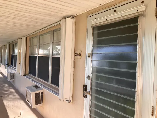 a view of walk in closet with empty room