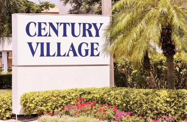 a sign broad in front of a wall