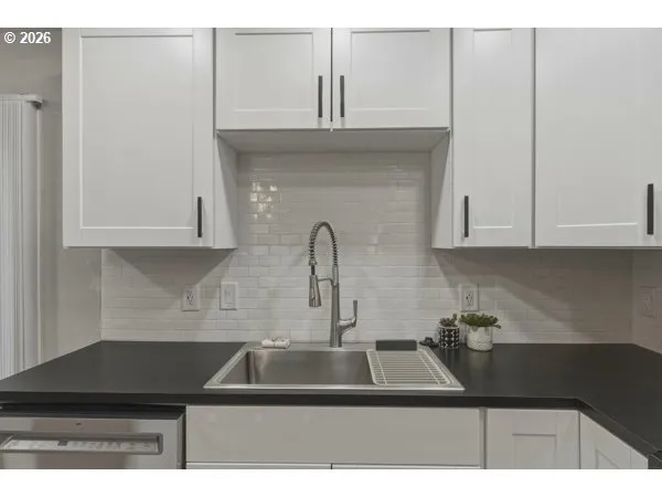 a kitchen with a sink and cabinets
