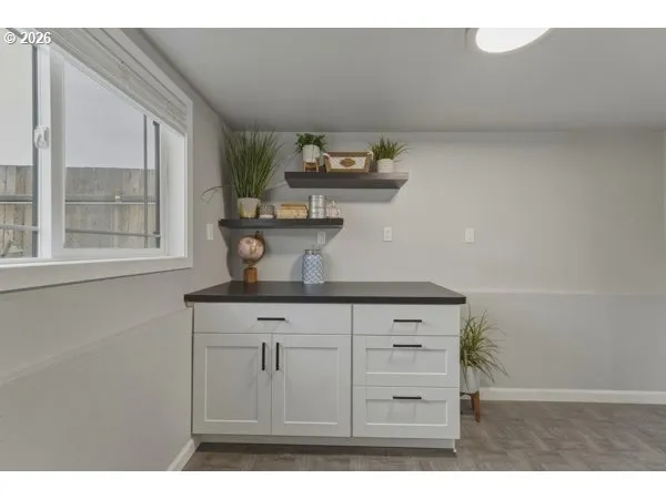 a view of cabinets and wooden floor