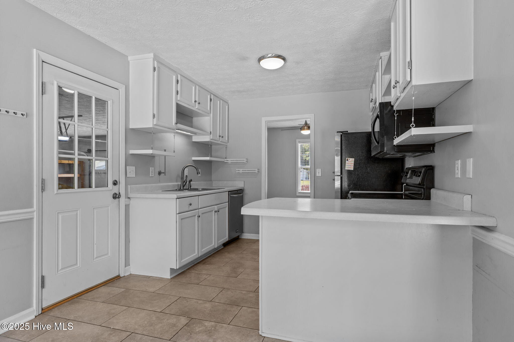 115 Countryside Court Newport, NC 28570 - Photo 13 of 52 View of the Kitchen and bar from the eat-in dining area