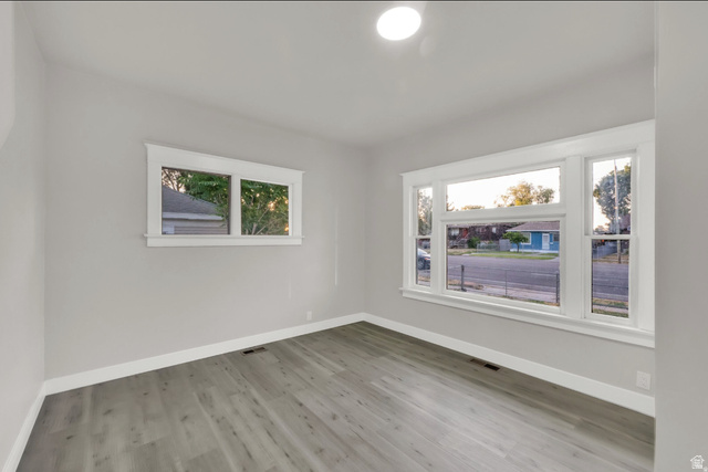 197 West Center Street Midvale, UT 84047 - Photo 8 of 12 Spare room featuring baseboards and light wood-style floors