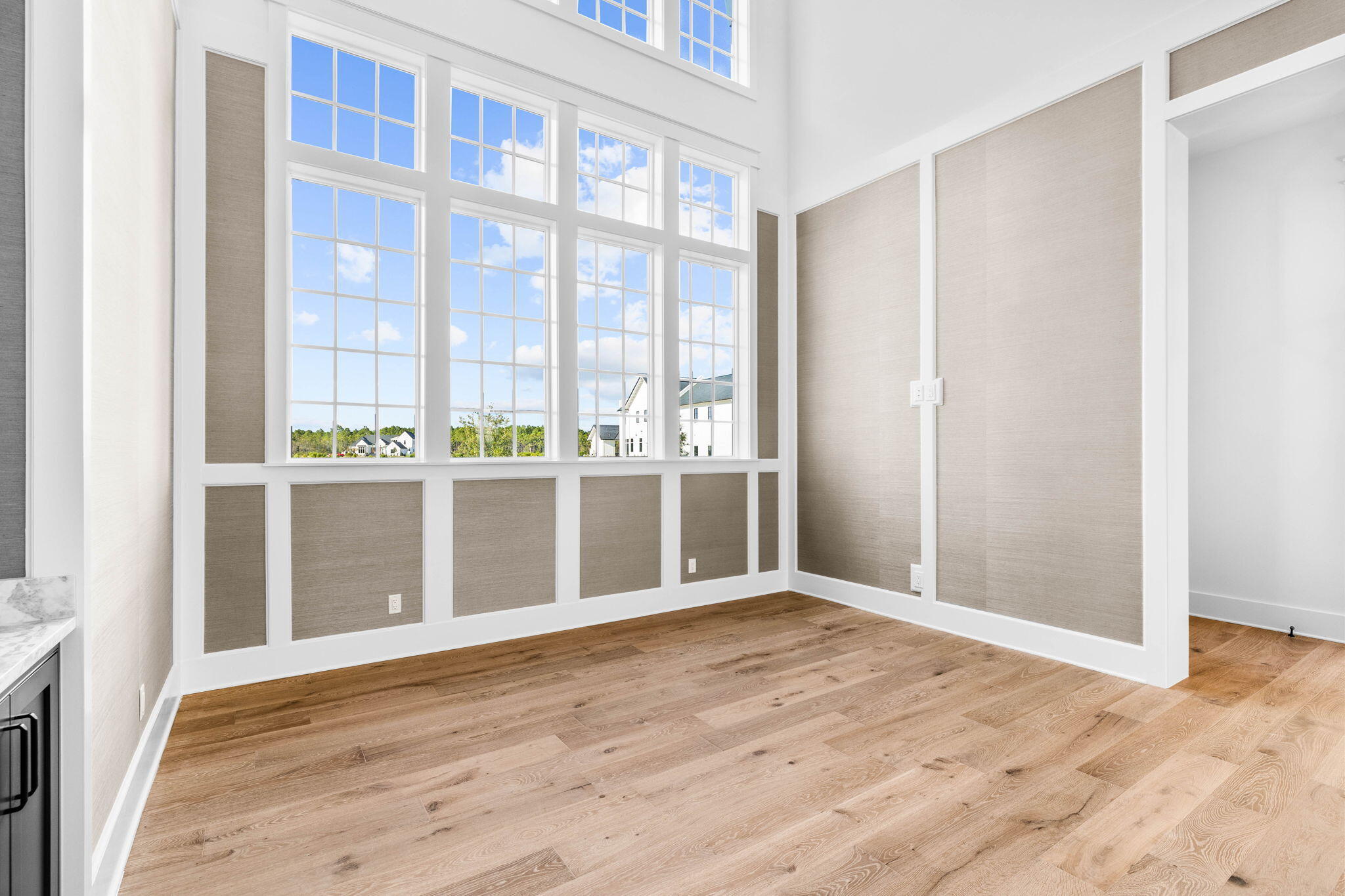 295 Golf Ridge Dr Inlet Beach Inlet Beach, FL 32461 - Photo 14 of 94 an empty room with wooden floor and windows