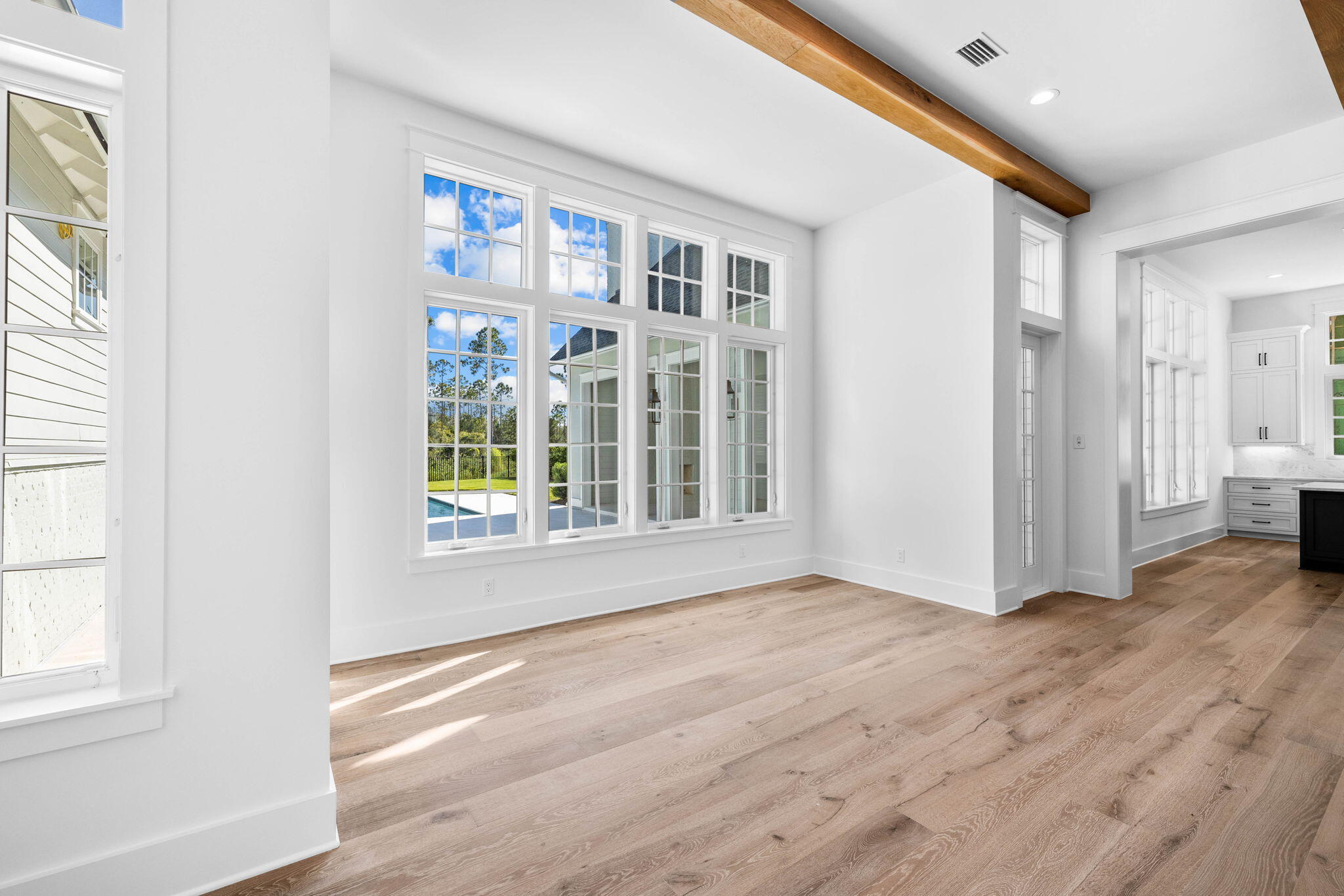 295 Golf Ridge Dr Inlet Beach Inlet Beach, FL 32461 - Photo 21 of 94 a view of an empty room with a window and wooden floor