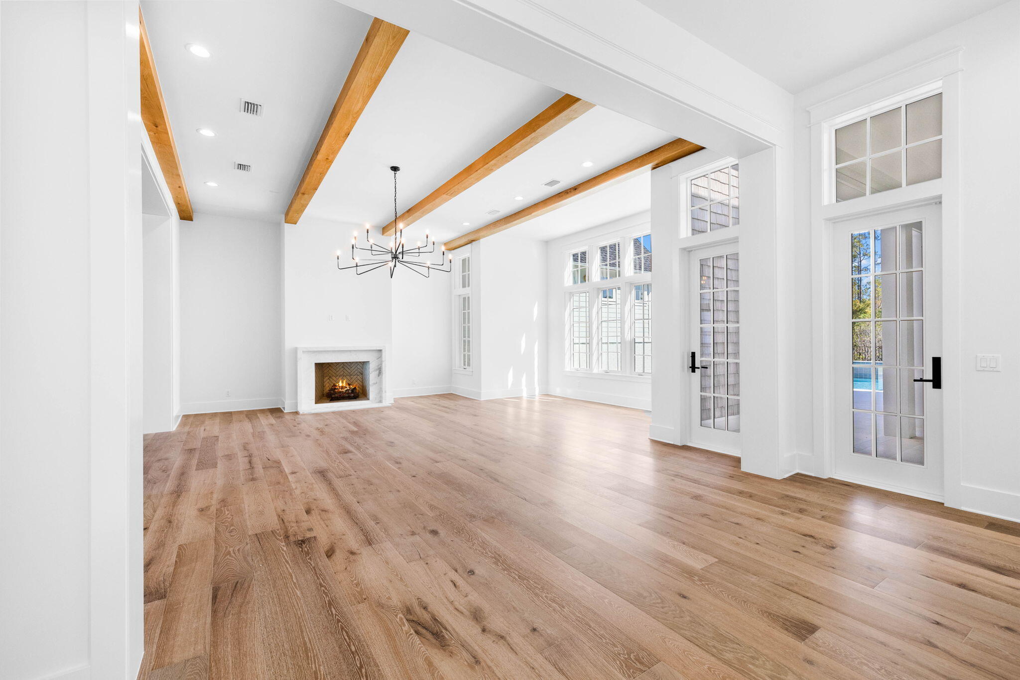 295 Golf Ridge Dr Inlet Beach Inlet Beach, FL 32461 - Photo 26 of 94 a view of an empty room with wooden floor and a fireplace