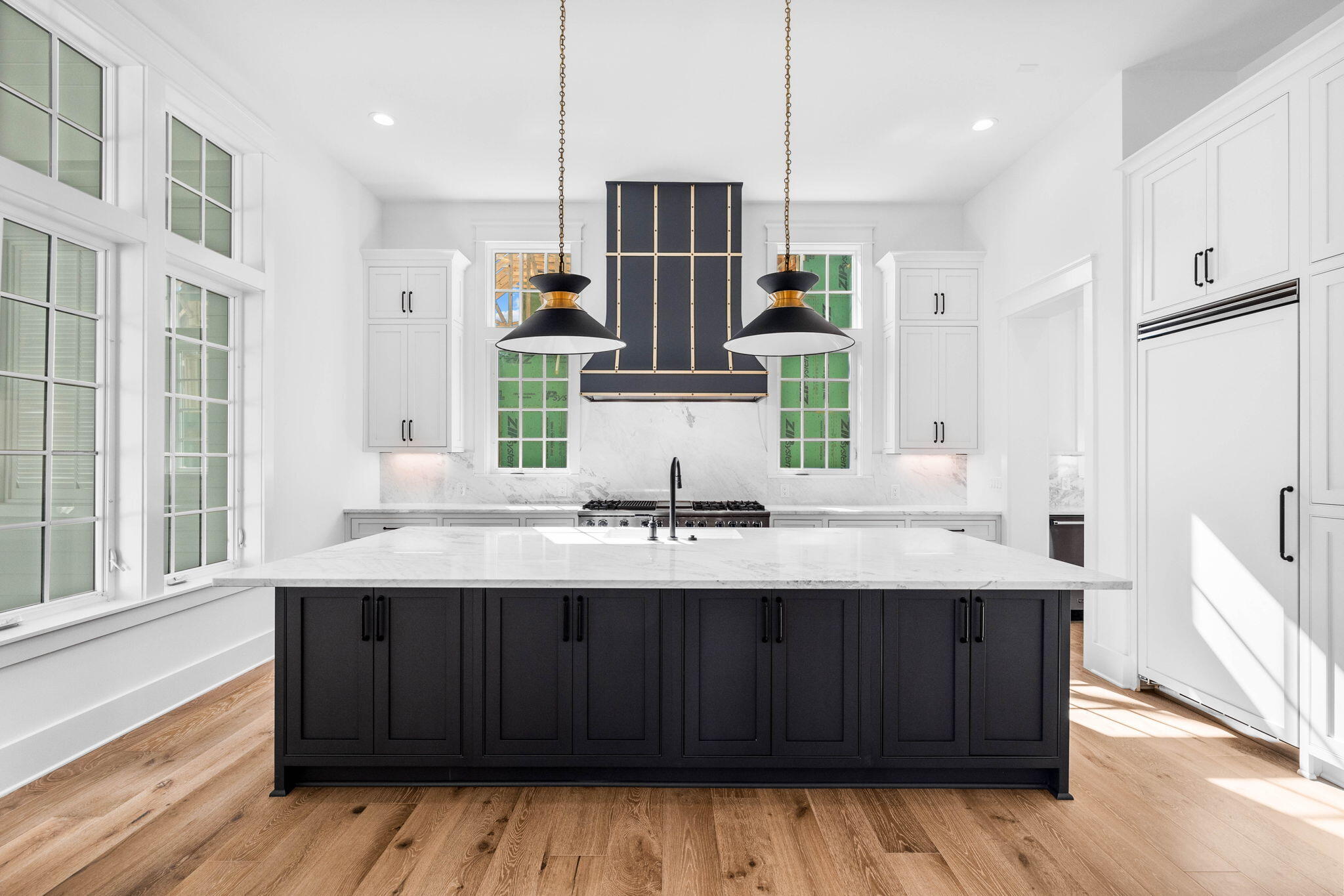 295 Golf Ridge Dr Inlet Beach Inlet Beach, FL 32461 - Photo 29 of 94 a kitchen with kitchen island granite countertop wooden cabinets and white appliances