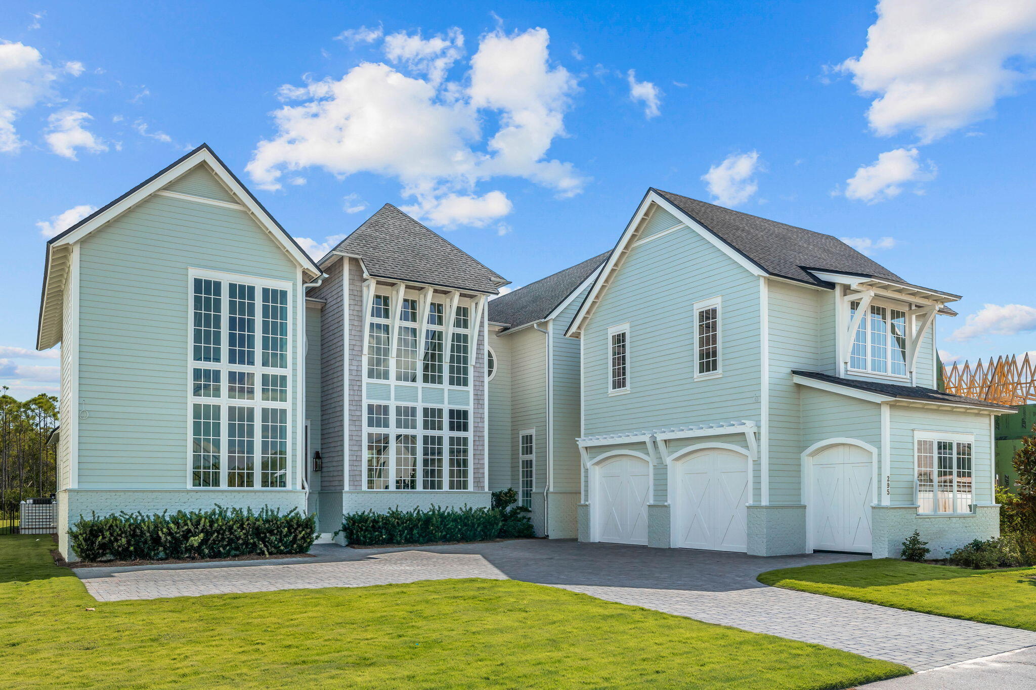 295 Golf Ridge Dr Inlet Beach Inlet Beach, FL 32461 - Photo 4 of 94 a front view of a house with a yard and garage