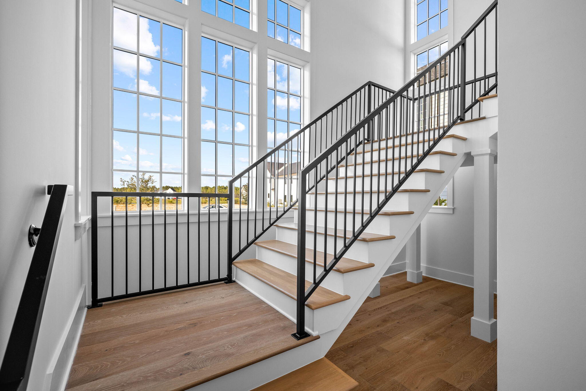 295 Golf Ridge Dr Inlet Beach Inlet Beach, FL 32461 - Photo 57 of 94 a view of staircase with lots of frames on wall and a window
