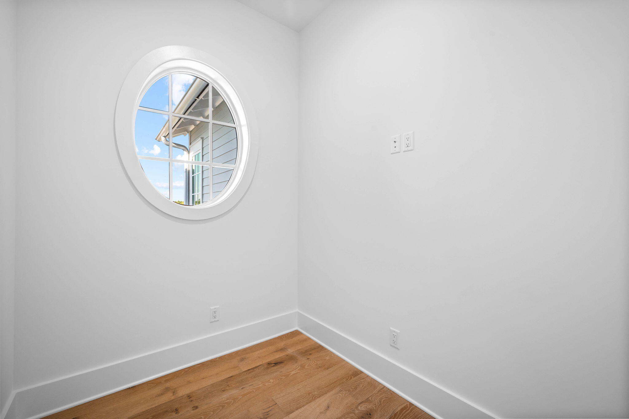 295 Golf Ridge Dr Inlet Beach Inlet Beach, FL 32461 - Photo 60 of 94 an empty room with a wooden floor and a window