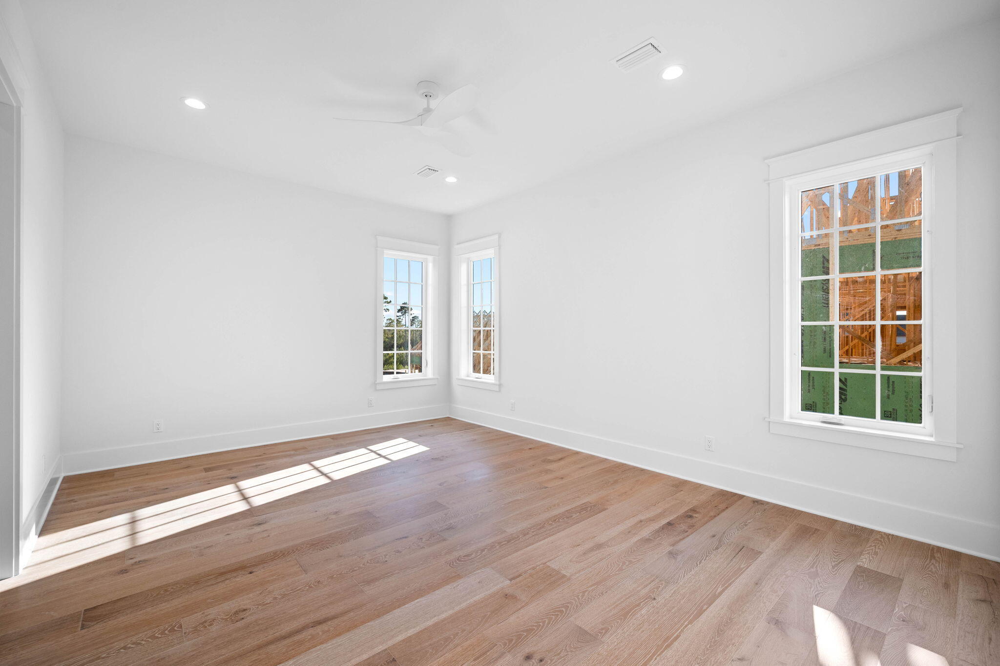 295 Golf Ridge Dr Inlet Beach Inlet Beach, FL 32461 - Photo 69 of 94 an empty room with wooden floor and windows