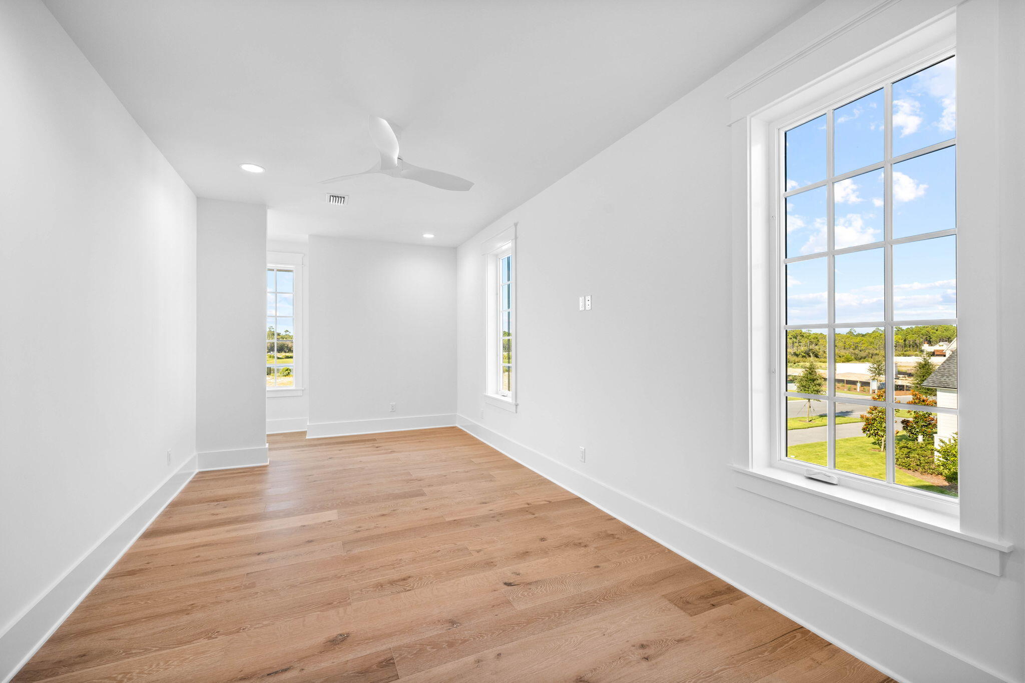 295 Golf Ridge Dr Inlet Beach Inlet Beach, FL 32461 - Photo 73 of 94 an empty room with windows and wooden floor
