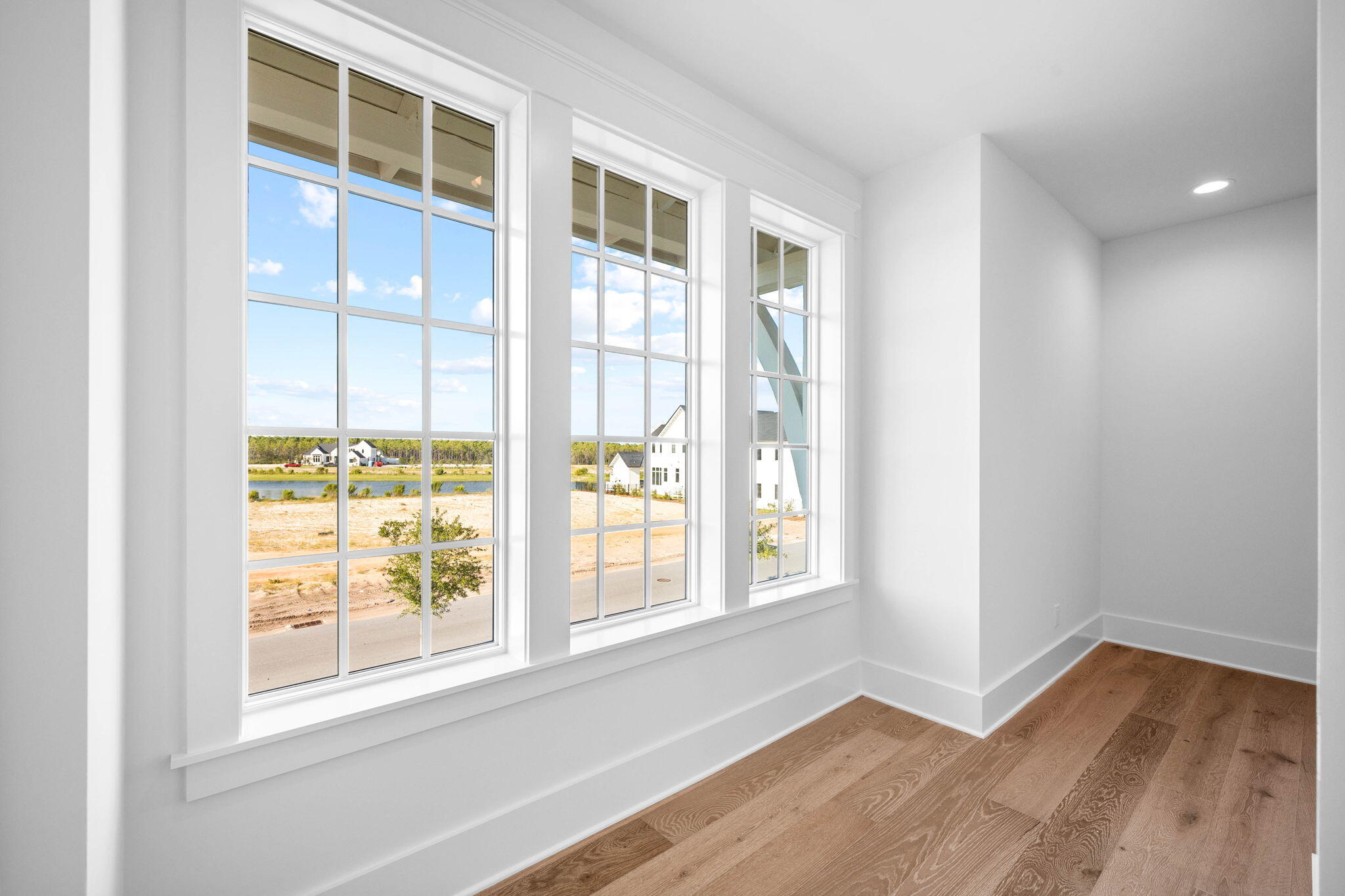 295 Golf Ridge Dr Inlet Beach Inlet Beach, FL 32461 - Photo 75 of 94 a view of an empty room with wooden floor and a window