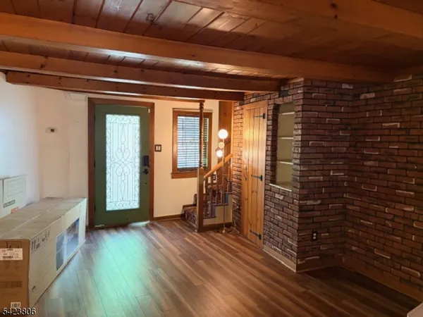 a view of entryway with wooden floor